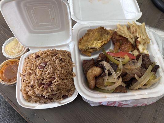 Griot dinner. Comes with rice beans, plantains & Mac. Sauce & pikliz