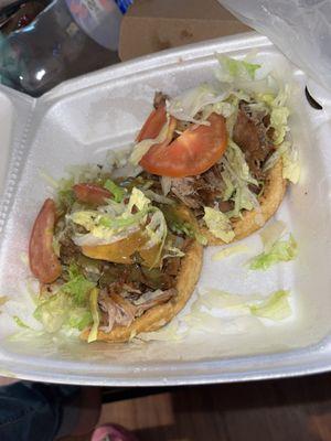 2 Sopes of carnitas no cheese no sour cream  Delicious !!