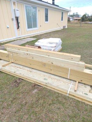 This is the construction material that they left out in the rain. this is supposed to be a enclosed deck with roof.