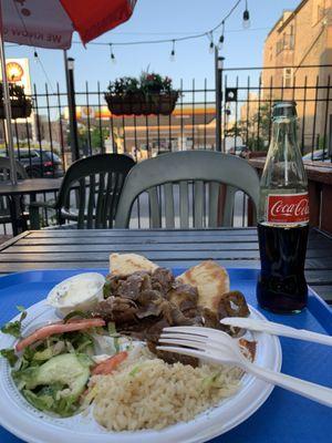 Outdoor dining with Gyros Plate ($15.49) and Mexican Coke ($2.95)