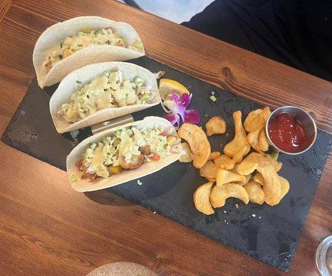 Fish tacos with spiraling fries