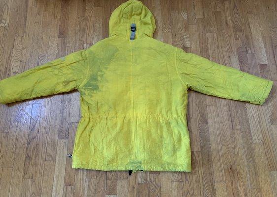 Back of the coat once a brilliant yellow. Ruined now that the  gray lining has bleed onto the exterior despite being machine washable.