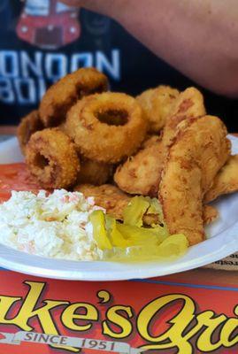 Chicken tenders, onion rings, and coleslaw.