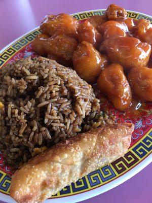 Orange chicken with fried rice and egg roll.