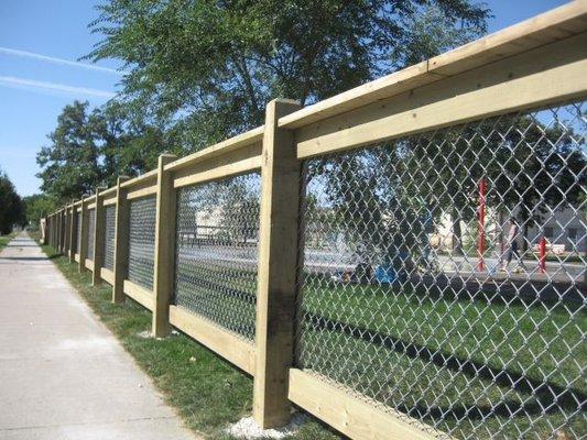 Treated wood boards with black chain link