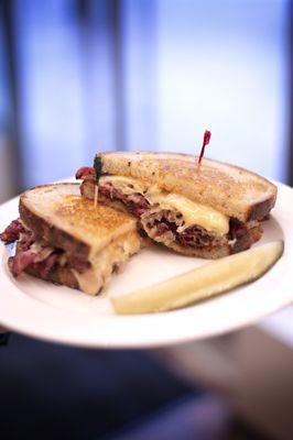 Pastrami, Swiss, sauerkraut, and Russian dressing on our light rye