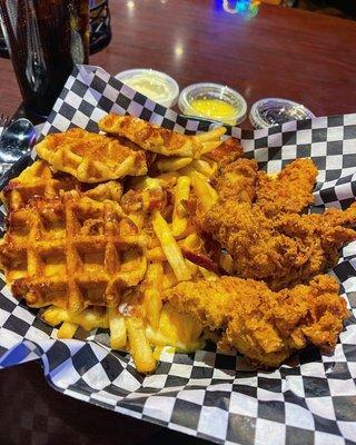 Chicken and waffles with loaded fries.