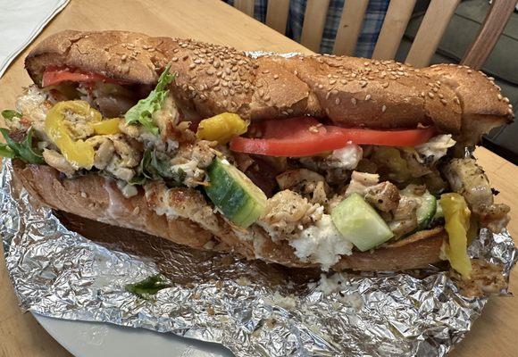 Large Athena Specialty Sub: grilled chicken, tomatoes, cukes, kalamata olives, banana peppers & greek dressing on a large braided roll ($13)