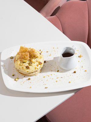 Indulge yourself in our Oriental pancakes! Soft orange cream, pistachios, crunchy phyllo squares, topped with hot cinnamon orange syrup!