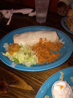 Chicken Burrito with queso on top