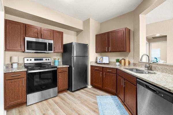 Kitchen with stainless steel appliances at Villas at Oakwell Farms