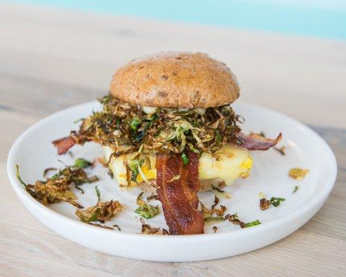 All the Feels egg sandwich with crispy brussel sprouts and bacon