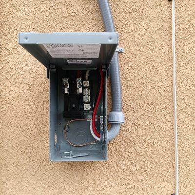 240 volt / 50 amp GFCI spa disconnect mounted to back exterior all.