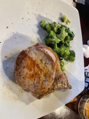 Bone-in Pork chop with Steamed Broccoli & Salad not shown.  (You get to pick two sides)