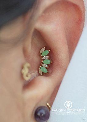 Conch piercing with an "Athena". 14k Yellow Gold with Chrysoprase & CZ's.