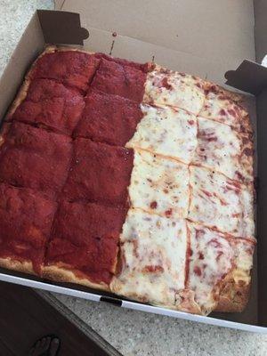 Sicilian pizza half with cheese half without