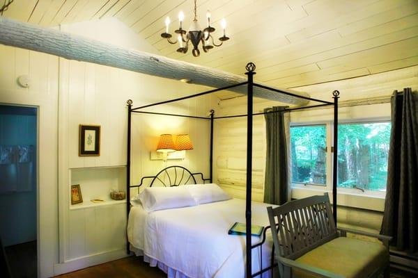 Cabin 1 features a queen bed, wood-burning fireplace and fully equipped kitchen.