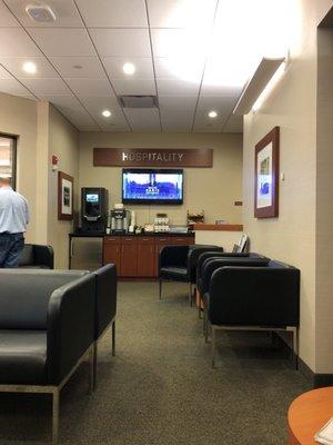 Comfortable waiting lounge with view of service bay area