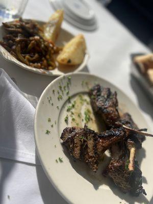 Lamb chops with greens and potatoes.