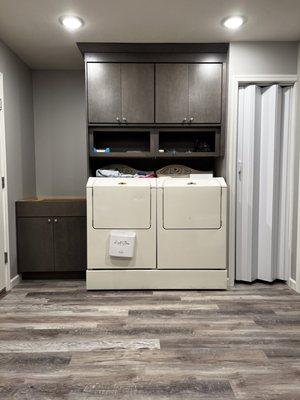 Love that we were able to hide the hot water heater behind the accordion doors to the right of the washer.