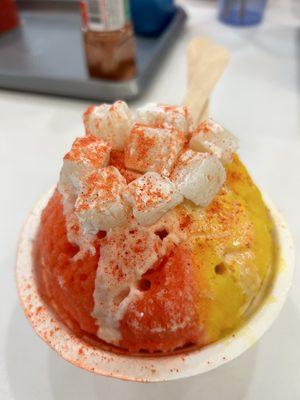 Ulu shaved ice with macadamia nut ice cream. Flavored with Li Hing, Mango, Guava and added a snow cap on top with mochi and Li hing powder