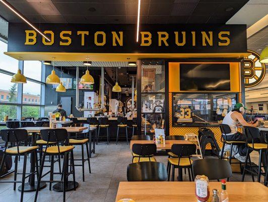 Boston Bruins bar next to Gates 14-16 in Terminal A satellite.