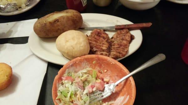 Grilled chicken breast with baked potato and salad bar