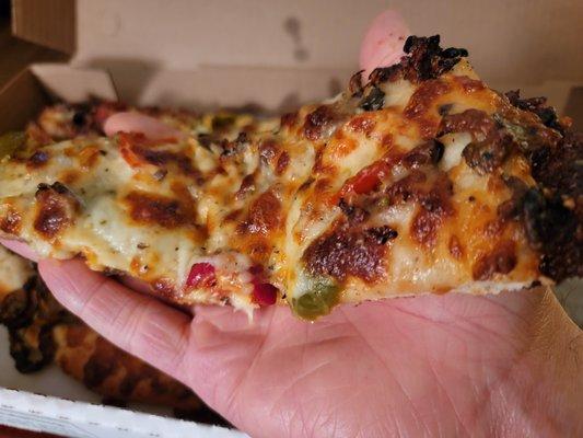 Half (9", 6 slice) Steak Pizza - One of the center slices, beware of the hot peppers