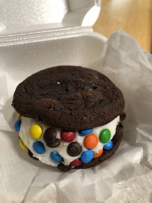 Chocolate cookie sandwiches with frosting and M&'s