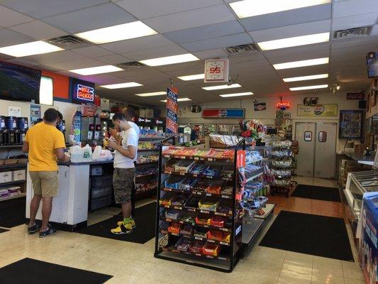 A small convenience store and indoor eating area next to the kitchen