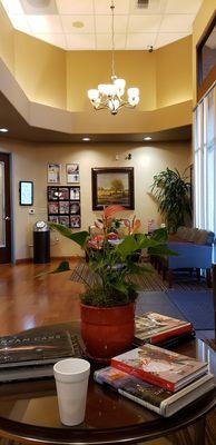 the cozy waiting room and my tea in a styro cup