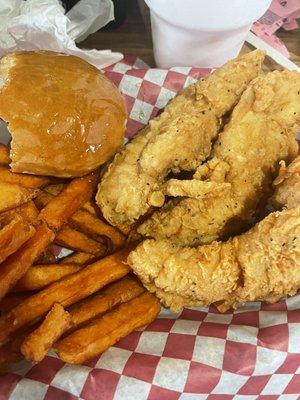 3 piece spicy tenders with sweet potato fries and a roll.