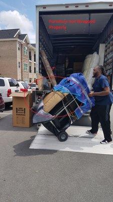 Couch not wrapped properly, and as a result there was a tear in the couch.