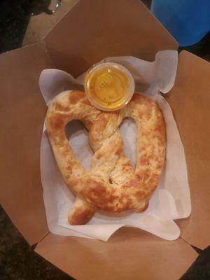 Delicious toasted parmesan pretzel with nacho cheese sauce!