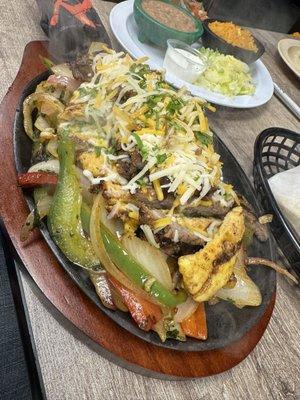 Three meats fajitas, I like how it comes out sizzling with shredded cheese on top !