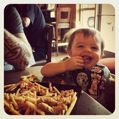 Adorable Kid enjoying Kid's Chicken Pakoras at Tarka Indian Kitchen