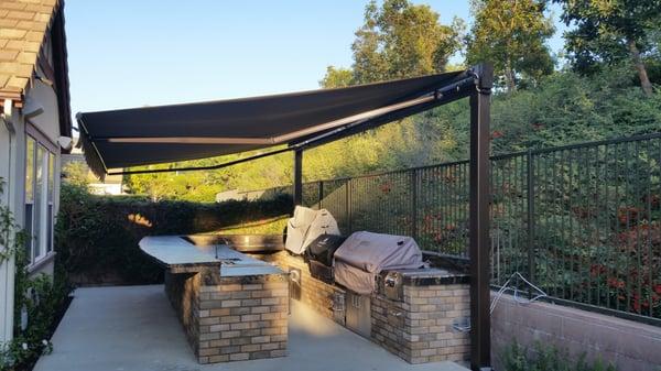 Retractable Awning over a BBQ island.
The Awning Company