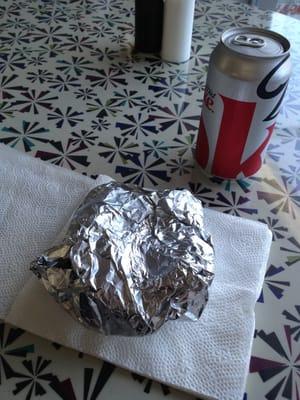 Three small tables inside. Soda in cans for $1.