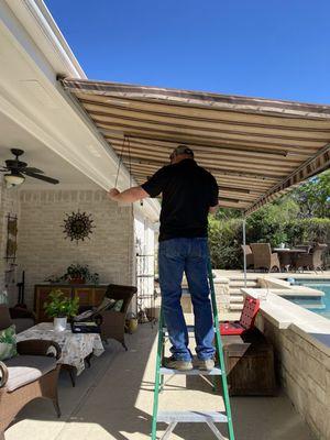 Jeremy Removing the Old and Ripped Awning