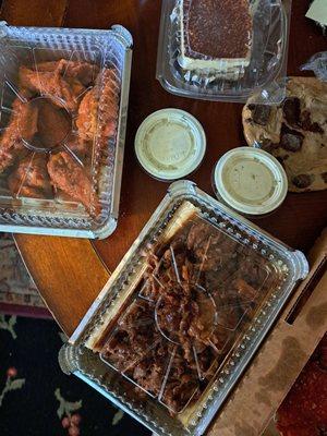 Buffalo wings with ranch dressing. BBQ beef on garlic bread, tiramisu and chocolate chip cookie