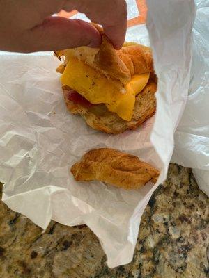 This was SUPPOSED to be a bacon ham and cheese croissant cut in half