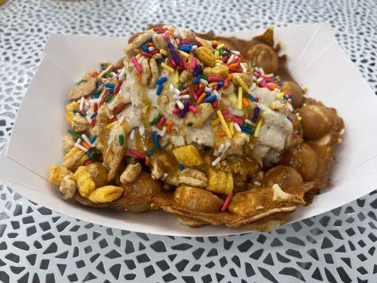 HoneySmacks, Golden Grahams, and Cap'n Crunch with Vanilla ice cream and Rainbow Sprinkles. We call this the Smack'n Cap'n.