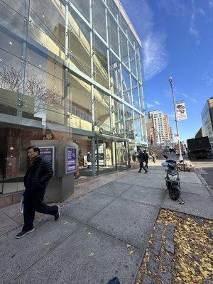 Street view. You are on your way to YASUBEE for great Ramen. ENTER QUEENS CROSSING HERE