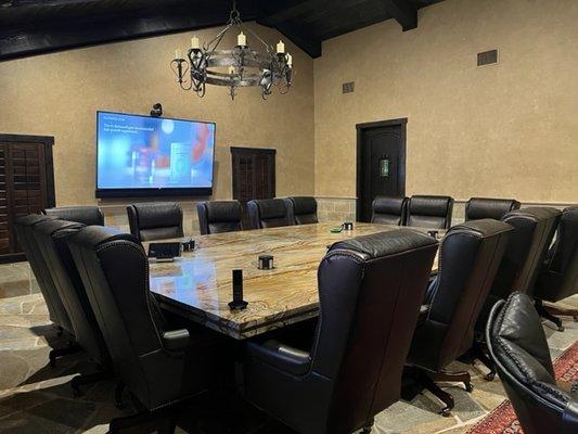 This is a conference room we did that has a camera pointed towards the table and a savant remote to control the room.