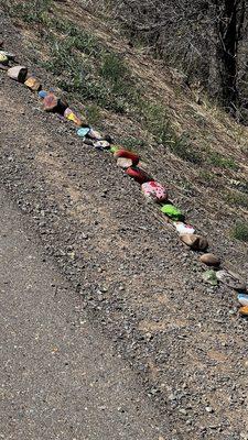 Hand painted rocks along the side of part of the path