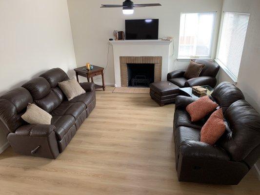 Our living room with brown leather furniture pieces we found at the Restore.