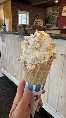 Small salted caramel pretzel on a waffle cone delicious.