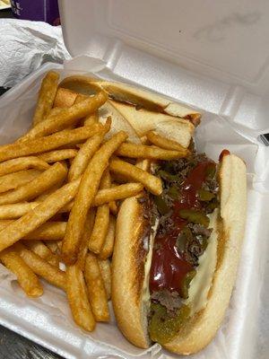 Cheesesteak hot peppers and side of fries