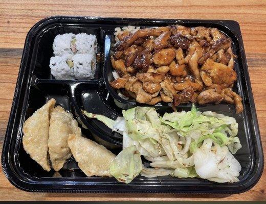 Chicken teriyaki bento box - chicken teriyaki, fried rice (also have white), 3 pieces sushi, pot stickers and cabbage