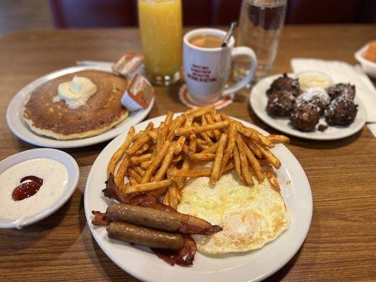 A combo with pancakes, eggs, sausage and bacon. With coffee and Orange Juice. Sub for seasoned fries.